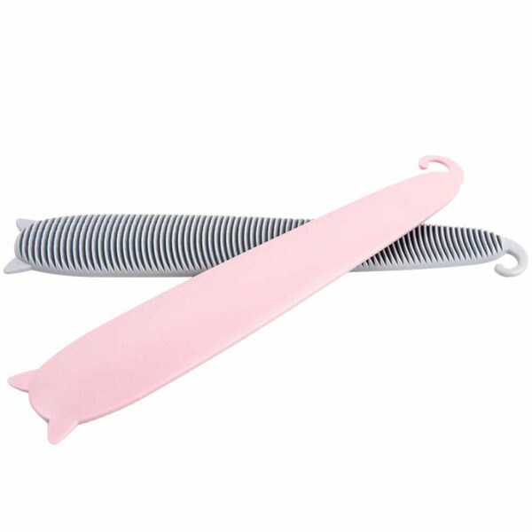 A pink cat comb on top of a grey one